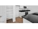 Well-organized walk-in pantry with white shelving located near the kitchen at 14644 W Sand Hills Rd, Surprise, AZ 85387