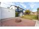 Backyard view showcasing patio, fire pit, and house exterior at 1506 E Topeka Dr, Phoenix, AZ 85024