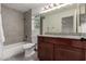 Bathroom with granite countertop and wood cabinets at 1506 E Topeka Dr, Phoenix, AZ 85024