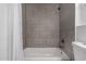 Shower/tub combo with gray tile surround at 1506 E Topeka Dr, Phoenix, AZ 85024