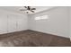 Spacious bedroom with ceiling fan and neutral carpeting at 1506 E Topeka Dr, Phoenix, AZ 85024