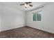 Spacious bedroom with window, ceiling fan and carpet at 1506 E Topeka Dr, Phoenix, AZ 85024