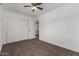 Well-lit bedroom with double door closet and carpet at 1506 E Topeka Dr, Phoenix, AZ 85024