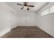 Bright bedroom with ceiling fan and neutral carpeting at 1506 E Topeka Dr, Phoenix, AZ 85024