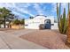 House exterior with driveway, landscaping, and basketball hoop at 1506 E Topeka Dr, Phoenix, AZ 85024