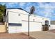 Front view of a white house with a garage and basketball hoop at 1506 E Topeka Dr, Phoenix, AZ 85024