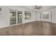 Living room with hardwood floors and sliding glass doors to backyard at 1506 E Topeka Dr, Phoenix, AZ 85024