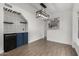 Stylish wet bar with blue cabinetry and patterned tile at 1506 E Topeka Dr, Phoenix, AZ 85024