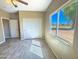 Bedroom with large window, double closets, and wood-look floors at 15235 S Country Club Dr, Arizona City, AZ 85123