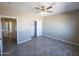 Spacious bedroom with double closets and wood-look floors at 15235 S Country Club Dr, Arizona City, AZ 85123