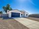 Newly built home with a modern exterior, two-car garage, and spacious driveway at 15235 S Country Club Dr, Arizona City, AZ 85123