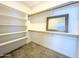 Spacious walk-in closet with ample shelving and hanging space at 15235 S Country Club Dr, Arizona City, AZ 85123