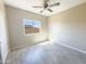 Well-lit bedroom with wood-look floors and a window at 15245 S Country Club Dr, Arizona City, AZ 85123