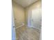 Laundry room with washer/dryer hookups and built-in shelving at 15245 S Country Club Dr, Arizona City, AZ 85123