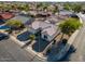 Single-story home with tile roof, desert landscaping, and a corner lot location at 15437 W Domingo Ln, Sun City West, AZ 85375