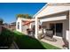 Relaxing backyard with patio furniture, putting green and artificial turf at 15437 W Domingo Ln, Sun City West, AZ 85375