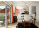 Dining area with a chandelier and sliding glass doors leading to the backyard at 15437 W Domingo Ln, Sun City West, AZ 85375