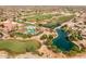 Aerial view of community with golf course and lake at 15513 W Coral Pointe Dr, Surprise, AZ 85374