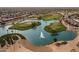 Aerial view of a golf course community with lakes at 15513 W Coral Pointe Dr, Surprise, AZ 85374