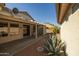 Covered patio, gravel landscaping, and mature agave plant at 15513 W Coral Pointe Dr, Surprise, AZ 85374