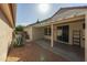 Covered patio, gravel landscaping, and mature agave plant at 15513 W Coral Pointe Dr, Surprise, AZ 85374