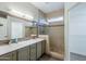 Bathroom with double vanity and walk-in shower at 15513 W Coral Pointe Dr, Surprise, AZ 85374