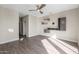 Bright bedroom with wood-look floors and ceiling fan at 15513 W Coral Pointe Dr, Surprise, AZ 85374