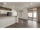 Bright dining area with wood-look floors and patio access at 15513 W Coral Pointe Dr, Surprise, AZ 85374