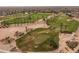 Landscaped golf course with palm trees and sand traps at 15513 W Coral Pointe Dr, Surprise, AZ 85374