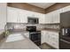 Well-equipped kitchen with double sink and granite countertops at 15513 W Coral Pointe Dr, Surprise, AZ 85374