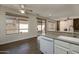 Modern kitchen with white cabinets and stainless steel appliances at 15513 W Coral Pointe Dr, Surprise, AZ 85374