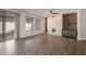 Bright living room featuring hardwood floors and a fireplace at 15513 W Coral Pointe Dr, Surprise, AZ 85374