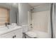 Clean bathroom with a shower/tub combo and white vanity at 15720 W Crocus Dr, Surprise, AZ 85379