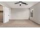 Bright bedroom with carpeted floor and ceiling fan at 15720 W Crocus Dr, Surprise, AZ 85379