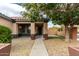 House entrance with walkway and potted plants at 15720 W Crocus Dr, Surprise, AZ 85379