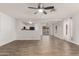 Bright living room with tile floors and a view into the kitchen at 15720 W Crocus Dr, Surprise, AZ 85379