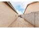 Narrow side yard with gravel and block wall at 15720 W Crocus Dr, Surprise, AZ 85379