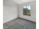 Bright bedroom with carpeted floor and large window at 1601 N Saba St # 306, Chandler, AZ 85225