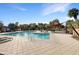 Community pool with patio furniture and shade structure at 1601 N Saba St # 306, Chandler, AZ 85225