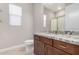 Bathroom features granite countertop, wooden cabinets, and a walk-in shower at 17183 W San Marcos St, Surprise, AZ 85388