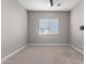 Simple bedroom with carpet, window blinds, and neutral wall paint at 17183 W San Marcos St, Surprise, AZ 85388