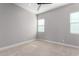 Well-lit bedroom with ceiling fan and neutral carpeting at 17183 W San Marcos St, Surprise, AZ 85388