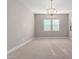 Bright bedroom featuring neutral walls and window blinds at 17183 W San Marcos St, Surprise, AZ 85388