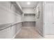 Ample closet space with custom shelving and hanging rods at 17183 W San Marcos St, Surprise, AZ 85388