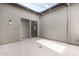 Private courtyard with sliding glass doors leading to interior spaces at 17183 W San Marcos St, Surprise, AZ 85388