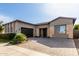 Modern single-story home with neutral exterior and landscaped front yard at 17183 W San Marcos St, Surprise, AZ 85388