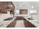 Modern kitchen with stainless steel appliances and granite countertops at 17183 W San Marcos St, Surprise, AZ 85388