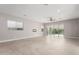 Bright and airy living room with tile floors and sliding glass doors at 17183 W San Marcos St, Surprise, AZ 85388