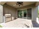 Outdoor patio with built-in grill and sliding glass doors at 17183 W San Marcos St, Surprise, AZ 85388