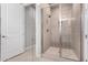 Large walk-in shower with glass enclosure and tiled seat at 17183 W San Marcos St, Surprise, AZ 85388